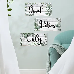 Three-piece wall art set with eucalyptus leaves and Good Vibes Only quote in Nordic style