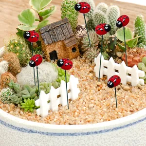 8-piece set of garden ladybug stakes featuring red resin insects for outdoor lawn decor