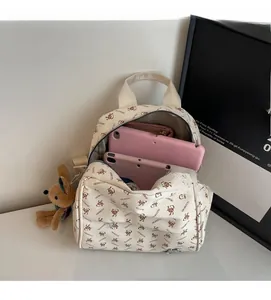 Interior view of off-white backpack showing spacious storage for tablet and wallet