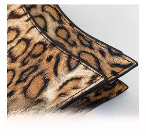 Detail showing high-quality leopard print material and precise stitching on the bag edge