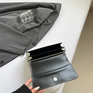 French chic black and white bow shoulder bag with chain strap and internal compartments