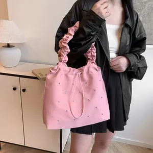 Pink pleated tote bag with silver studs and drawstring detail for women