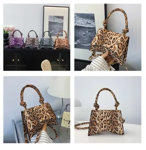 Detail showing various leopard print hourglass handbags with knotted handles and shoulder straps