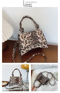 Detail of leopard print handbag with curved base and twisted knot top handle detail