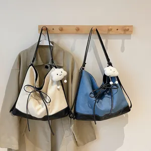 Contrast bow backpack and tote bags in cream canvas and blue denim with cute cloud charms