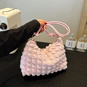 Pink bubble textured hobo bag with pleated cloud design and braided handle for women