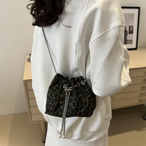 Stylish leopard print drawstring bucket bag with silver chain strap and pearl accents