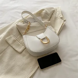 Minimalist white leather half-moon shoulder bag with gold metal buckle and chain strap