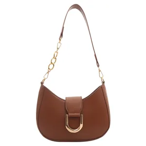 Brown faux leather crescent dumpling bag with golden D-ring and metal chain strap