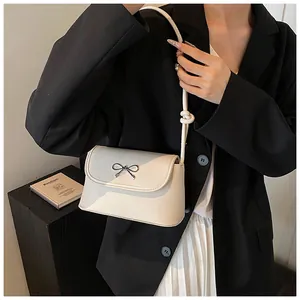 Cream white bow shoulder bag with textured faux leather for elegant women's daily style