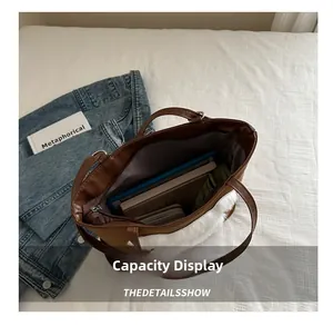 Detailed interior of tote bag showing large capacity for tablet, books and wallet