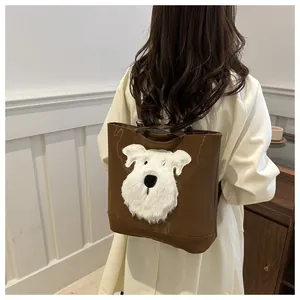 Brown PU leather tote bag featuring a cute white plush puppy embroidery shown on model