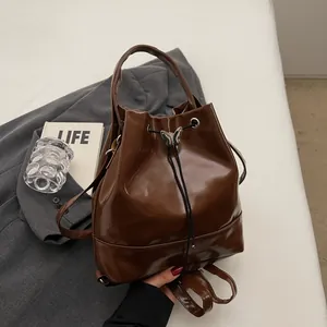 Women Fashion PU Leather Butterfly Buckle Drawstring Bucket Bag Versatile Shoulder Bag Backpack Commuting Handbag Girls