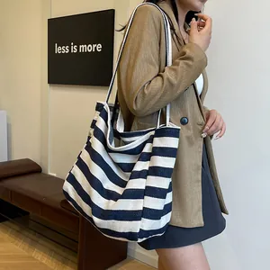 Classic black and white striped canvas shoulder bag with large capacity for daily use