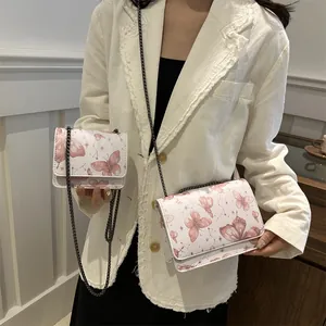 Sac à bandoulière blanc avec imprimé papillon et chaîne en métal en deux tailles