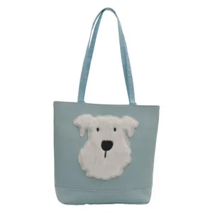 Light blue tote bag with plush puppy design and versatile shoulder straps for daily use