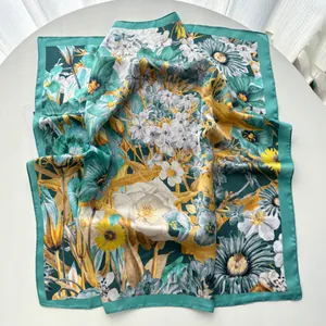 Detailed macro view of nature floral print silk scarf with sunflower and green border