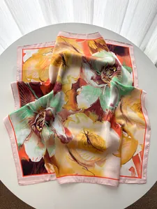 Detail of silk satin scarf showing colorful floral print and elegant glossy texture