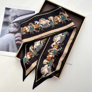 Close-up of elegant horse print satin twilly scarf neatly placed in a luxury gift box