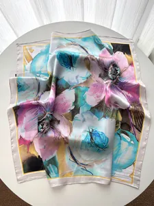 Macro view of oil painting floral silk scarf with cream borders and yellow accents