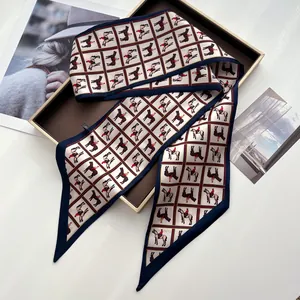 Detailed view of elegant vintage equestrian horse pattern silk scarf on a brown tray