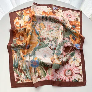 Detailed macro view of vintage floral print on elegant faux silk square scarf with satin finish