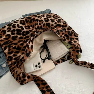Leopard print tote bag with large capacity showing phone and wallet for daily use