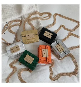 Mini stone-textured crossbody bags in six vibrant colors with elegant gold chain straps