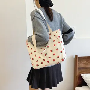 Large capacity corduroy tote bag with red strawberry print and wide shoulder strap