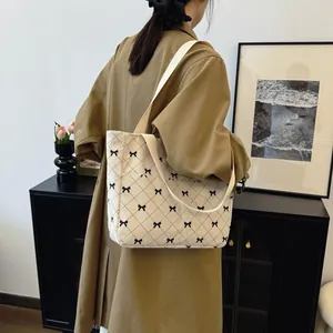Large capacity corduroy tote bag with embroidered bows and quilted stitch details