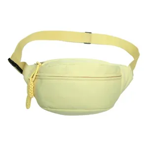Minimalist cream yellow dumpling chest bag in durable nylon with adjustable strap