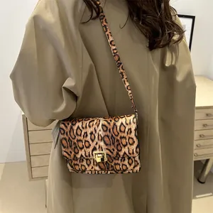Chic leopard print crossbody square bag with gold metal buckle and leather strap