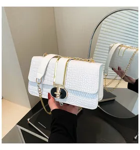 White faux crocodile skin crossbody bag with gold lock and chain strap detail
