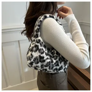 Detailed texture of black and white leopard print faux fur tote bag for women