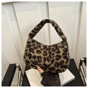 Detailed view of the soft faux fur leopard print hobo bag with a zipper closure