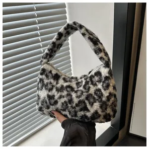 Close-up of the soft black and white leopard print faux fur texture on the tote bag