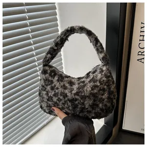 Detail of soft leopard print plush faux fur hobo bag with a secure silver zipper closure