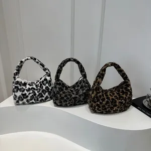 Chic leopard print plush tote bags in three colors displayed on a minimalist white stand