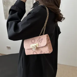 Pink chain crossbody bag with letter prints and rhinestone heart lock for women