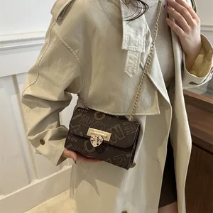 Fashionable dark brown crossbody bag with letter print and gold heart lock detail