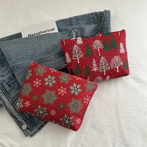 Trousses à maquillage de Noël en tissu rouge avec motifs flocons et sapins de Noël