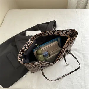 Leopard print tote bag with large capacity showing tablet and daily items inside