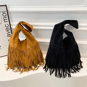 Retro faux suede fringed tote bag with bohemian tassels in brown and black colors