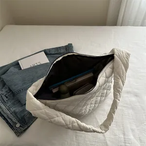 White quilted puffer tote bag showing large capacity for laptop and daily essentials