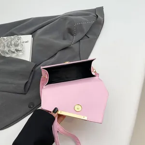 Pink minimalist crossbody bag with magnetic gold clasp and premium PU leather finish