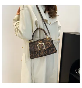 Fashionable leopard print handbag styled with a cream trench coat for a retro winter look