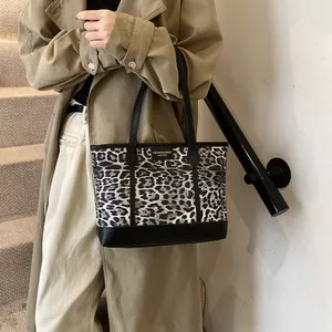 Retro leopard print tote bag with black handles and metal logo for winter daily commute