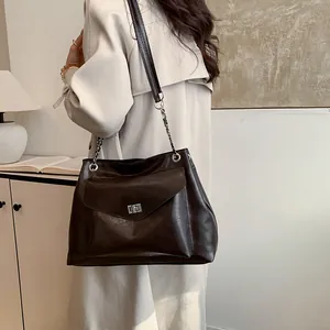 Dark brown large tote bag with polished oil wax leather and silver chain strap