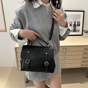 Retro black leather satchel with gold buckles and adjustable strap for women