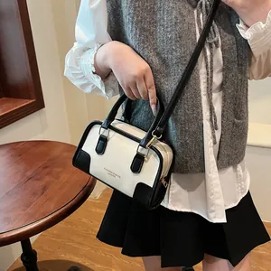 Contrast color retro bowling bag for women featuring panda theme and top-handle design